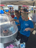 Volunteers Making Cotton Candy at National Night Out