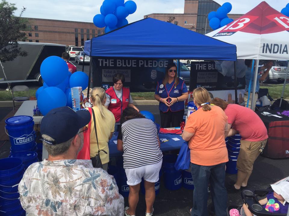 Volunteers and Patrons at The Blue Pledge Booth